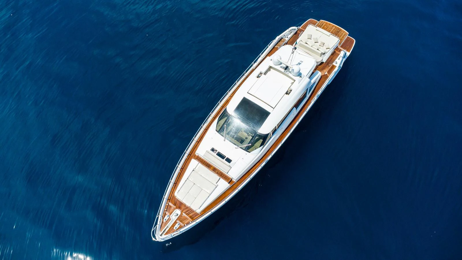 A sleek and elegant yacht glides gracefully on the deep blue sea. aboard LUCHI Yacht for Sale