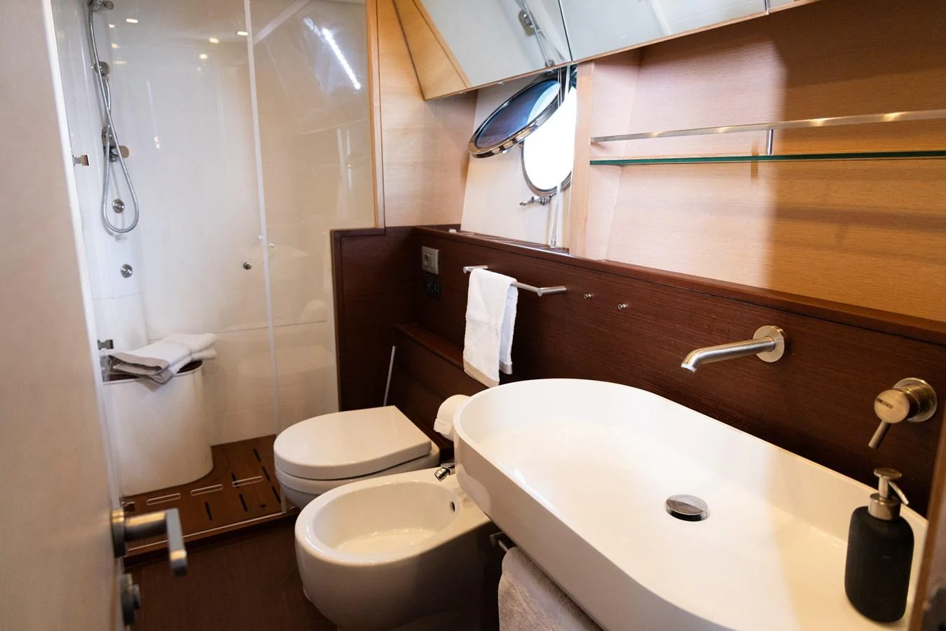 The yacht's bathroom features modern fixtures and a spacious shower area. aboard LUCHI Yacht for Sale