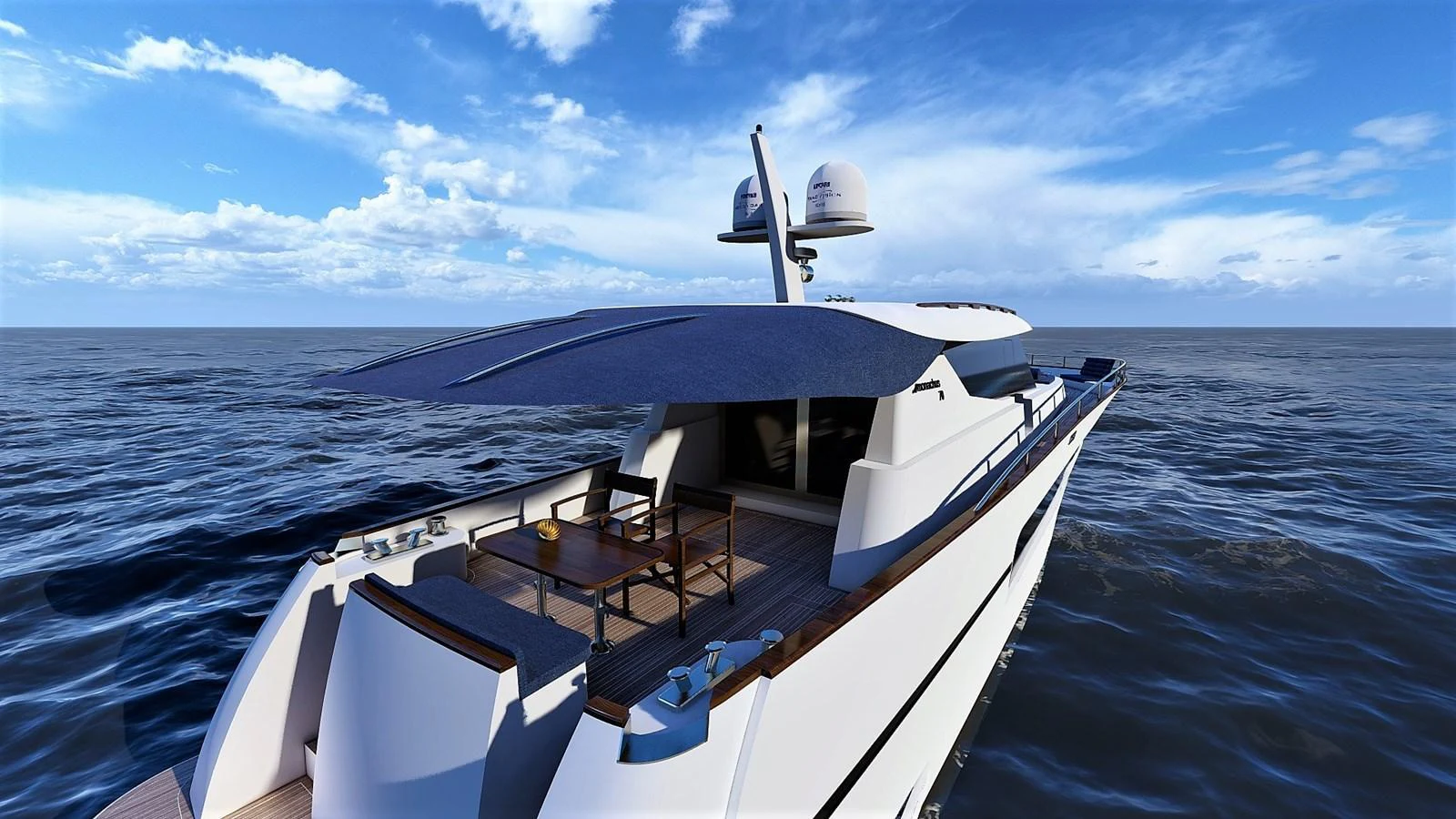 The yacht's aft deck features a shaded seating area with a stunning ocean backdrop. aboard MONACHUS 70 ST Yacht for Sale