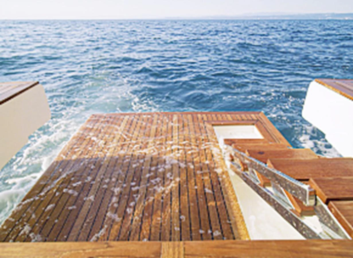 The yacht features a spacious swim platform with teak decking, perfect for easy access to the water. aboard MONACHUS 70 FLY Yacht for Sale