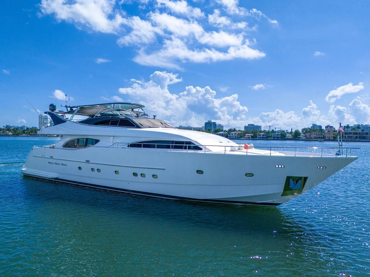 A sleek and elegant yacht cruising on calm waters under a bright blue sky. aboard FERRETTI YACHTS CUSTOM LINE 94 Yacht for Sale