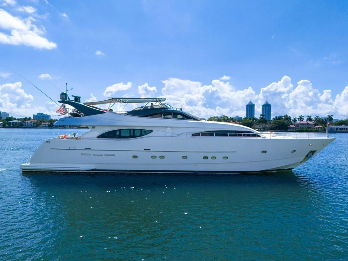 A sleek and elegant yacht cruising on calm waters under a clear blue sky. aboard FERRETTI YACHTS CUSTOM LINE 94 Yacht for Sale
