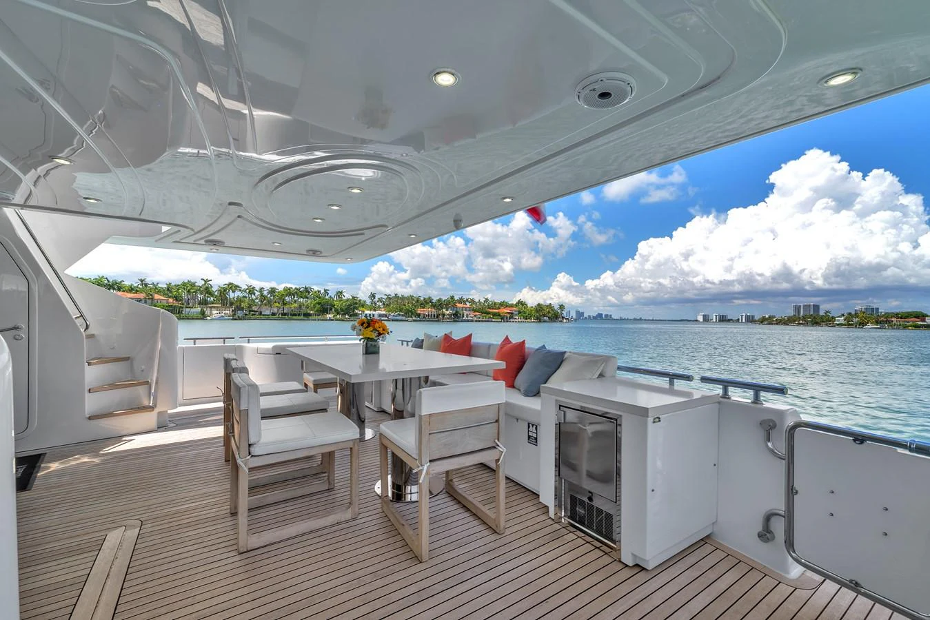 The aft deck offers a spacious and inviting area for alfresco dining with stunning water views. aboard FERRETTI YACHTS CUSTOM LINE 94 Yacht for Sale