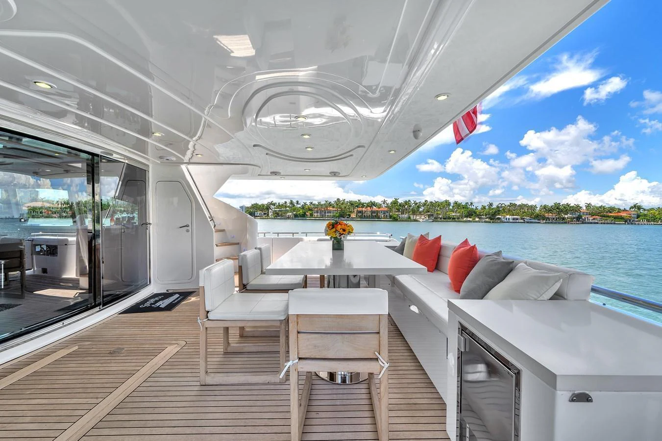 The aft deck offers a luxurious outdoor dining area with comfortable seating and stunning views. aboard FERRETTI YACHTS CUSTOM LINE 94 Yacht for Sale
