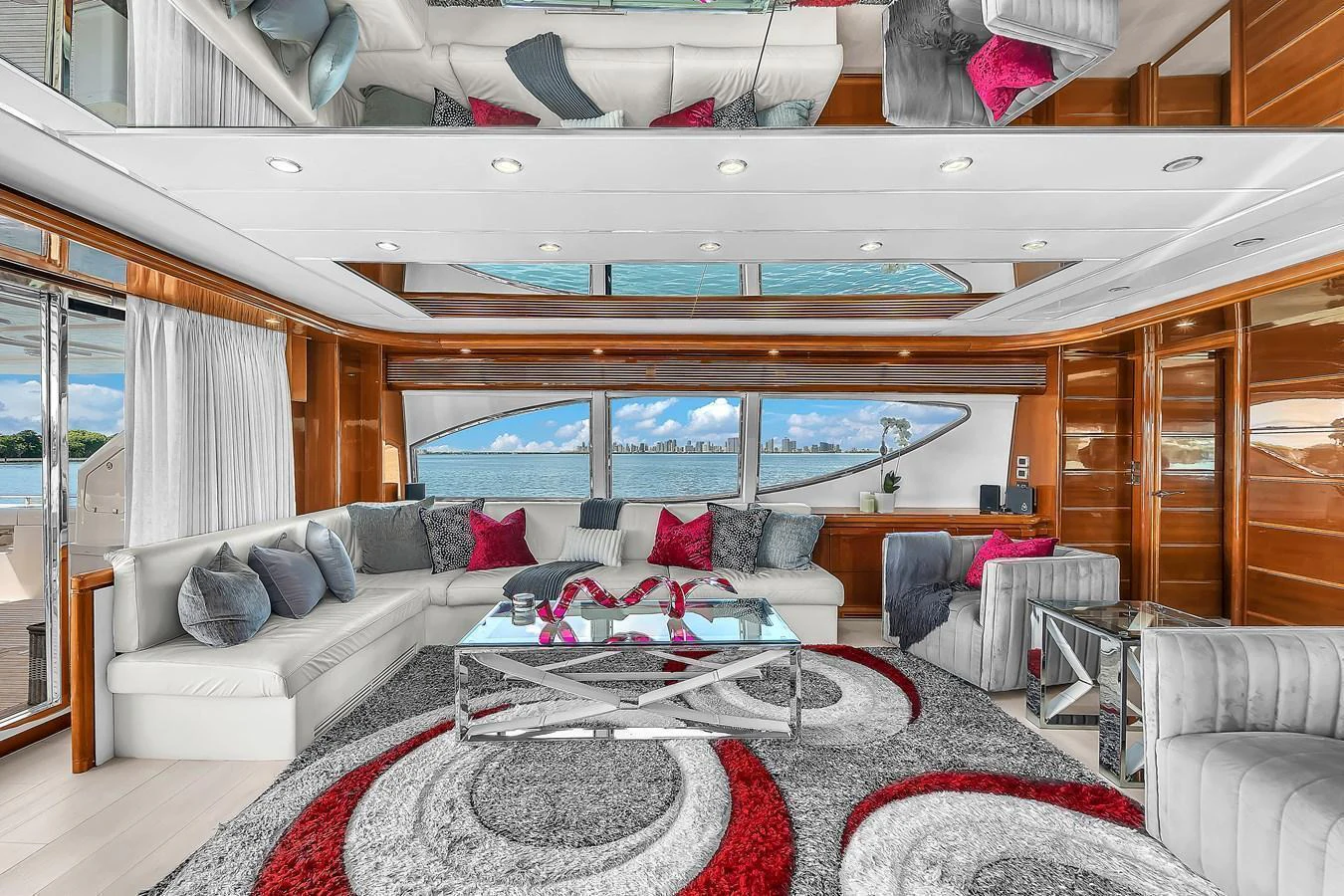 The salon features a spacious seating area with modern decor and large windows offering stunning sea views. aboard FERRETTI YACHTS CUSTOM LINE 94 Yacht for Sale