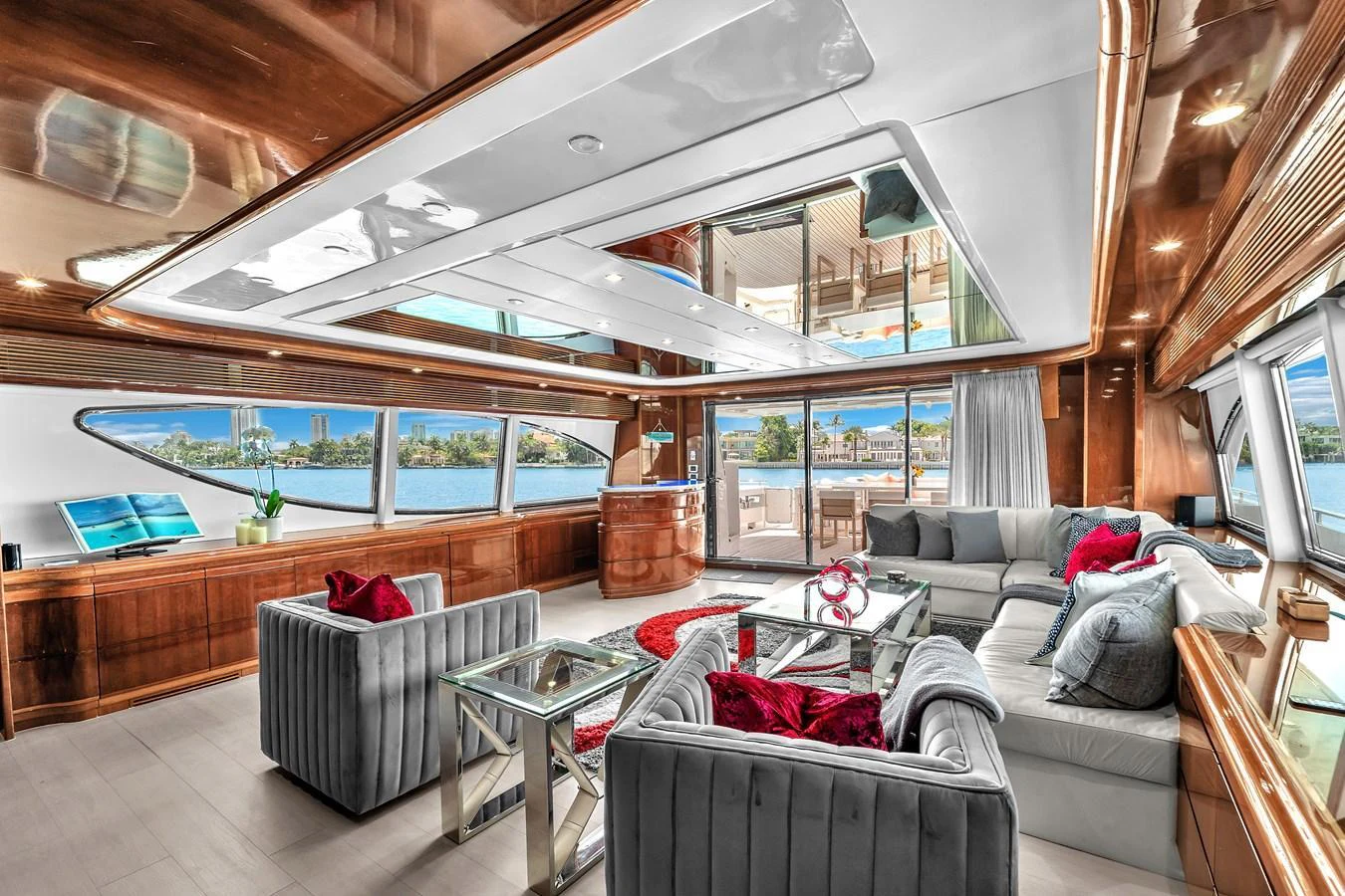 The luxurious salon features plush seating, elegant wood finishes, and expansive windows offering stunning views. aboard FERRETTI YACHTS CUSTOM LINE 94 Yacht for Sale