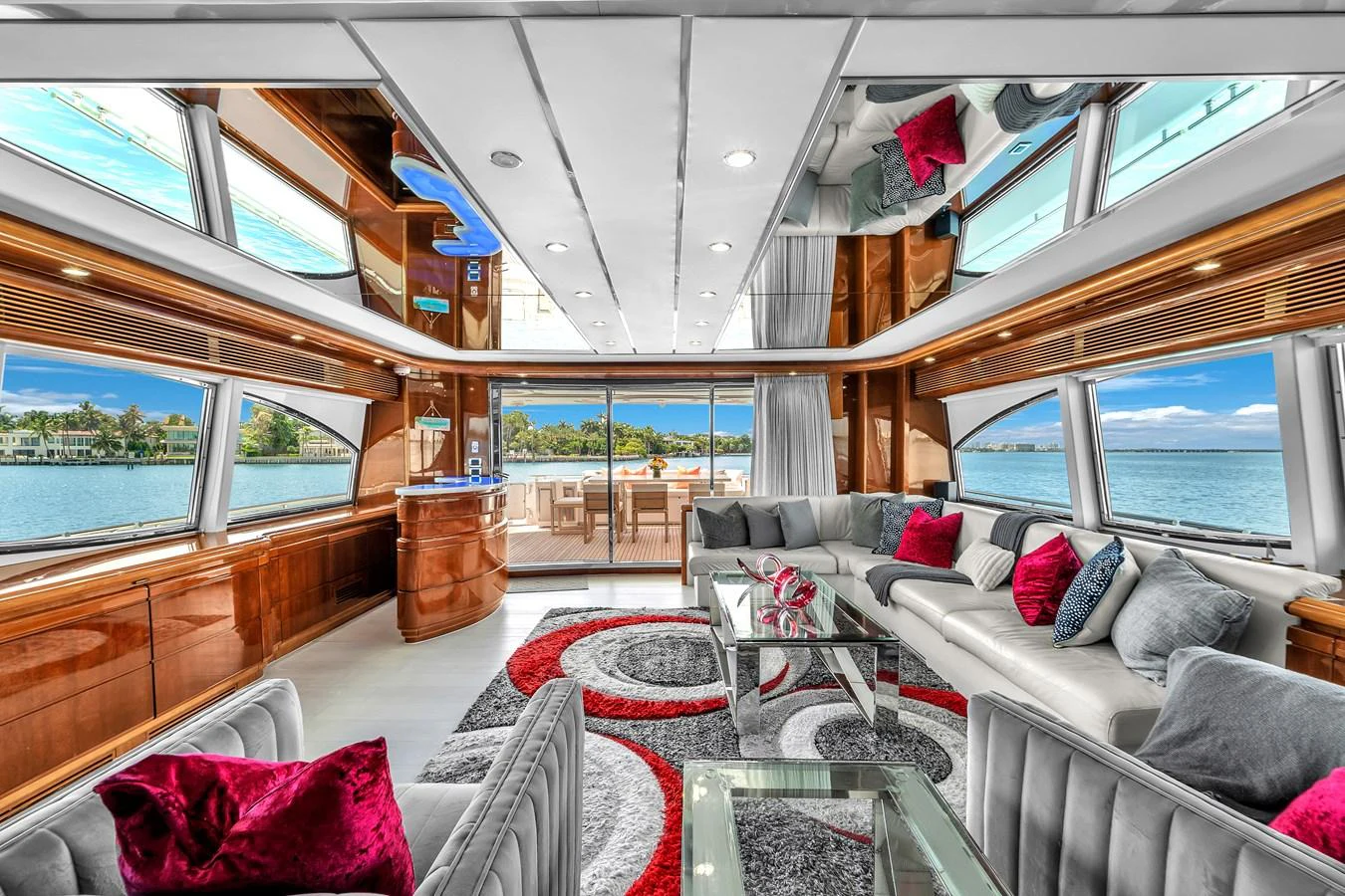 The salon features luxurious seating with panoramic windows offering stunning views. aboard FERRETTI YACHTS CUSTOM LINE 94 Yacht for Sale