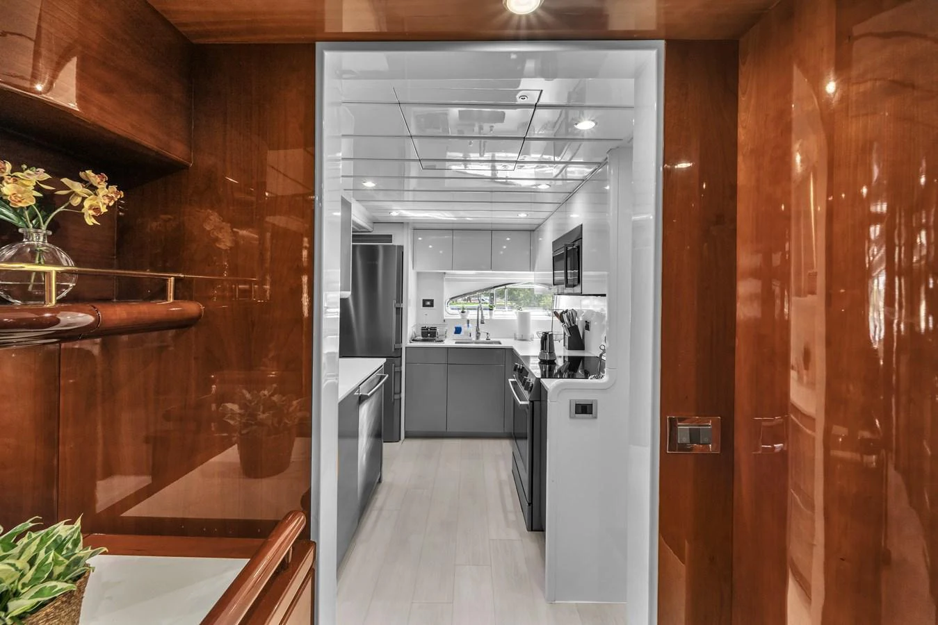 The modern galley features sleek cabinetry and high-end appliances, perfect for gourmet cooking at sea. aboard FERRETTI YACHTS CUSTOM LINE 94 Yacht for Sale