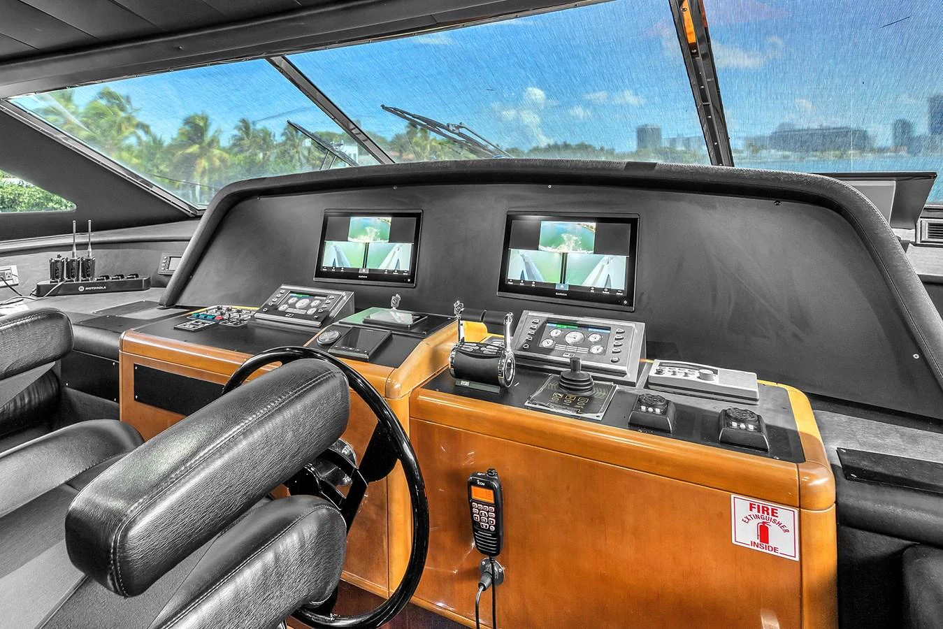 The helm station offers a commanding view with state-of-the-art navigation equipment and luxurious seating. aboard FERRETTI YACHTS CUSTOM LINE 94 Yacht for Sale