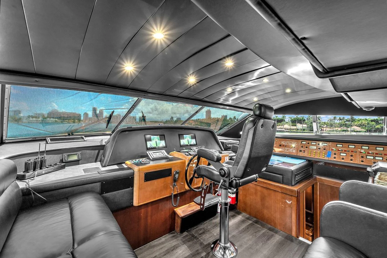 The helm station features advanced navigation equipment and luxurious seating with panoramic views. aboard FERRETTI YACHTS CUSTOM LINE 94 Yacht for Sale