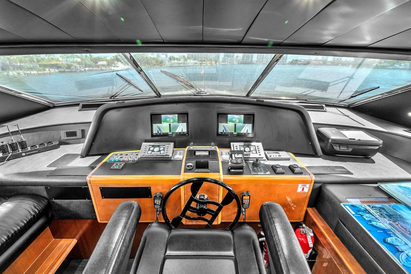 The helm station offers a commanding view with state-of-the-art navigation equipment and luxurious seating. aboard FERRETTI YACHTS CUSTOM LINE 94 Yacht for Sale