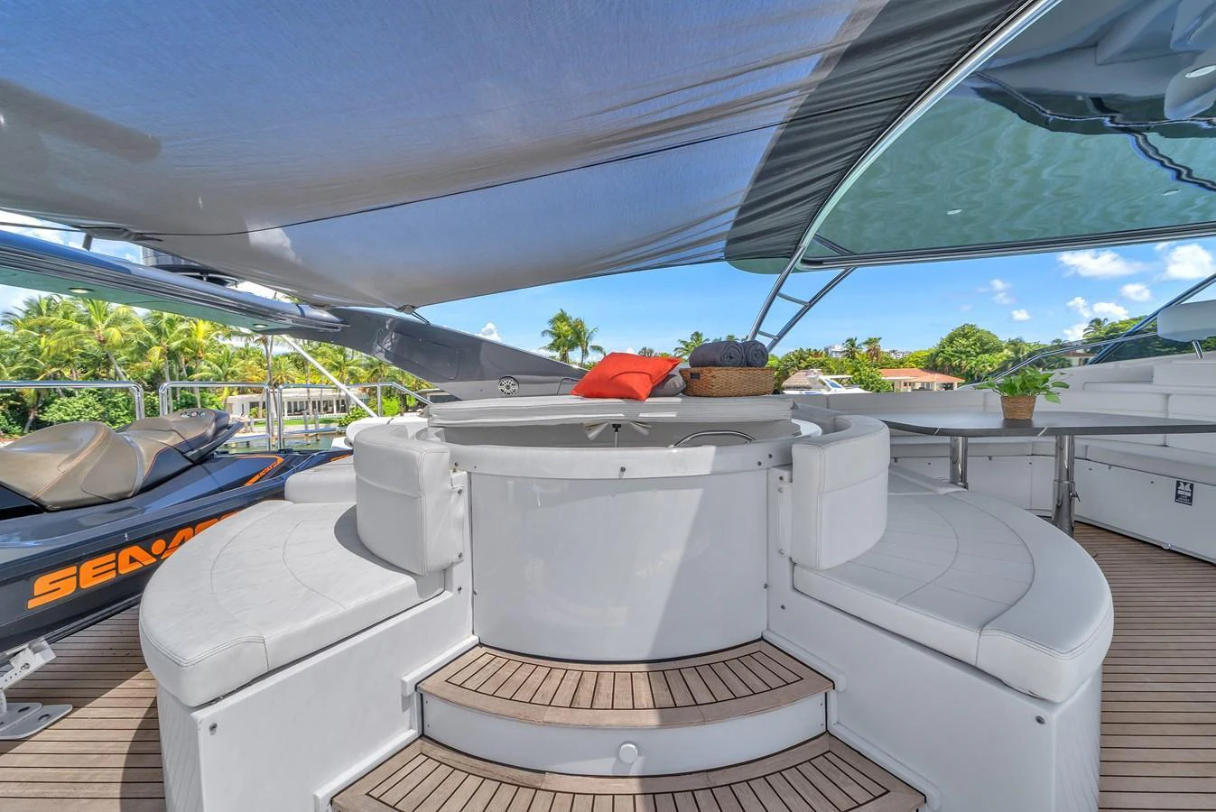 The flybridge offers a comfortable seating area with a shaded canopy, perfect for relaxation. aboard FERRETTI YACHTS CUSTOM LINE 94 Yacht for Sale