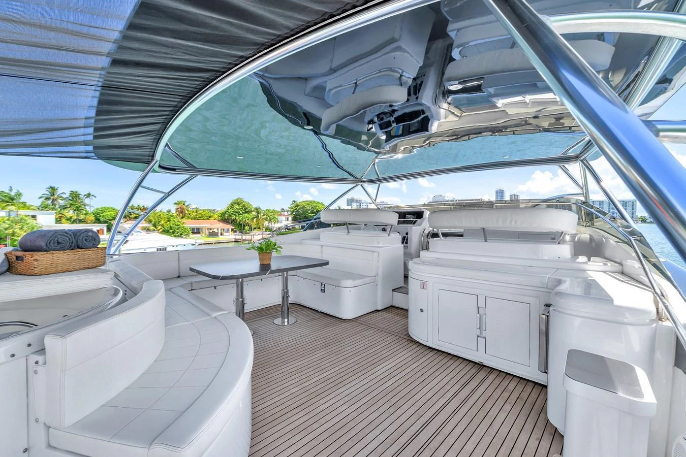 The flybridge offers a spacious and luxurious outdoor seating area with ample shade and stunning views. aboard FERRETTI YACHTS CUSTOM LINE 94 Yacht for Sale