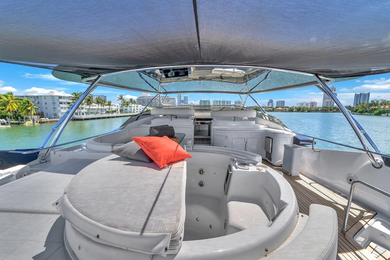 The flybridge offers a spacious and luxurious area with a hot tub and ample seating, perfect for relaxation and enjoying the view. aboard FERRETTI YACHTS CUSTOM LINE 94 Yacht for Sale