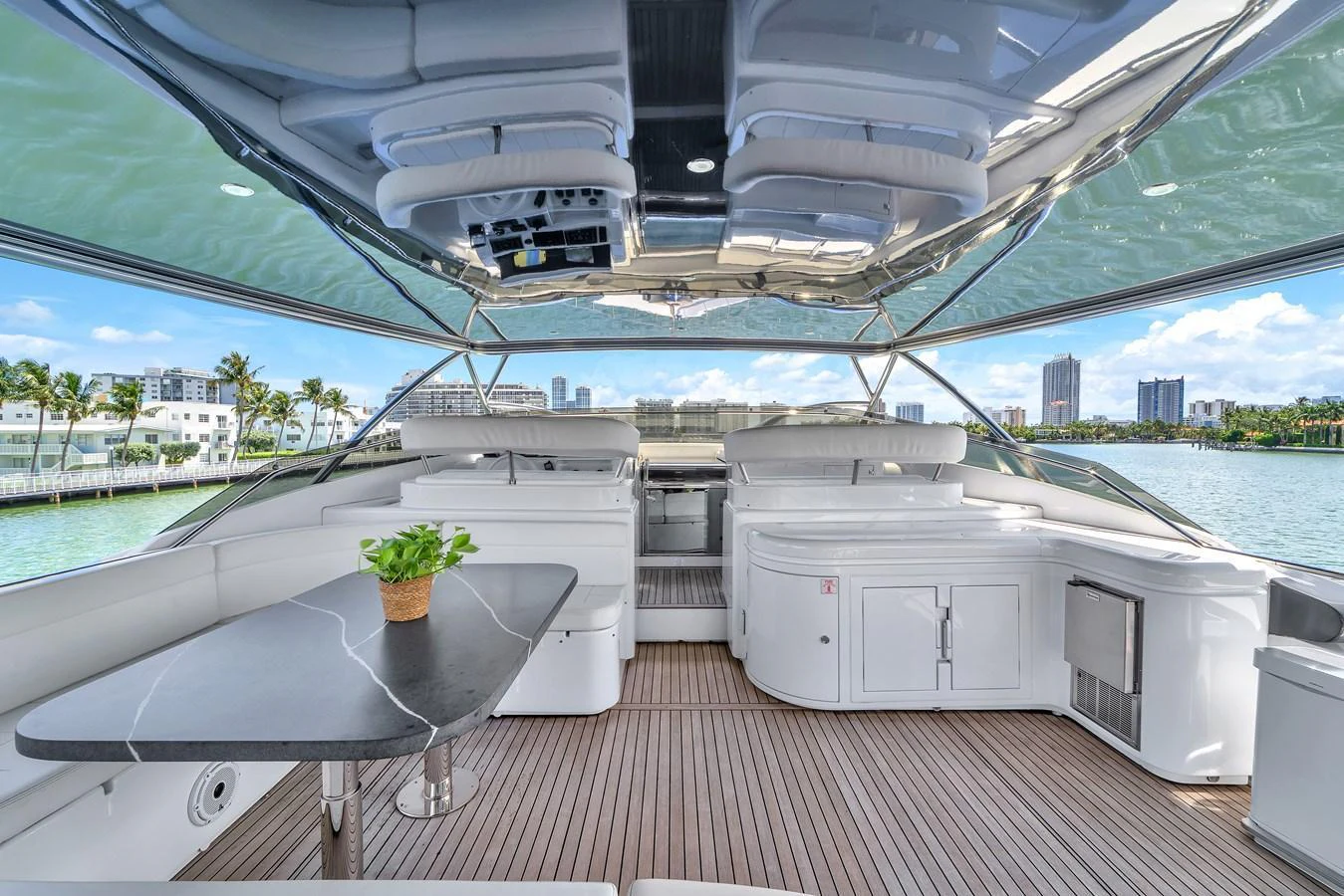 The flybridge offers a spacious and luxurious outdoor area with ample seating and a stunning view. aboard FERRETTI YACHTS CUSTOM LINE 94 Yacht for Sale