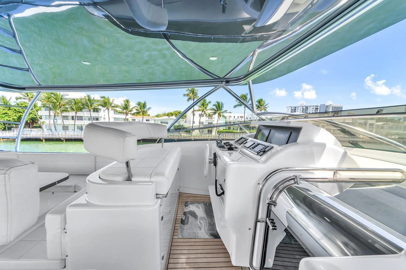 The helm area features modern controls and comfortable seating with a panoramic view. aboard FERRETTI YACHTS CUSTOM LINE 94 Yacht for Sale