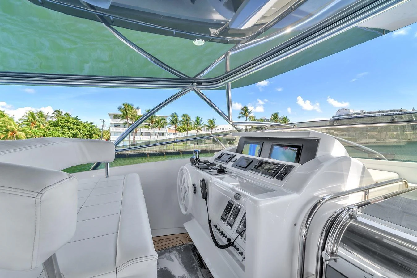 The helm station offers a sleek and modern control area with panoramic views. aboard FERRETTI YACHTS CUSTOM LINE 94 Yacht for Sale