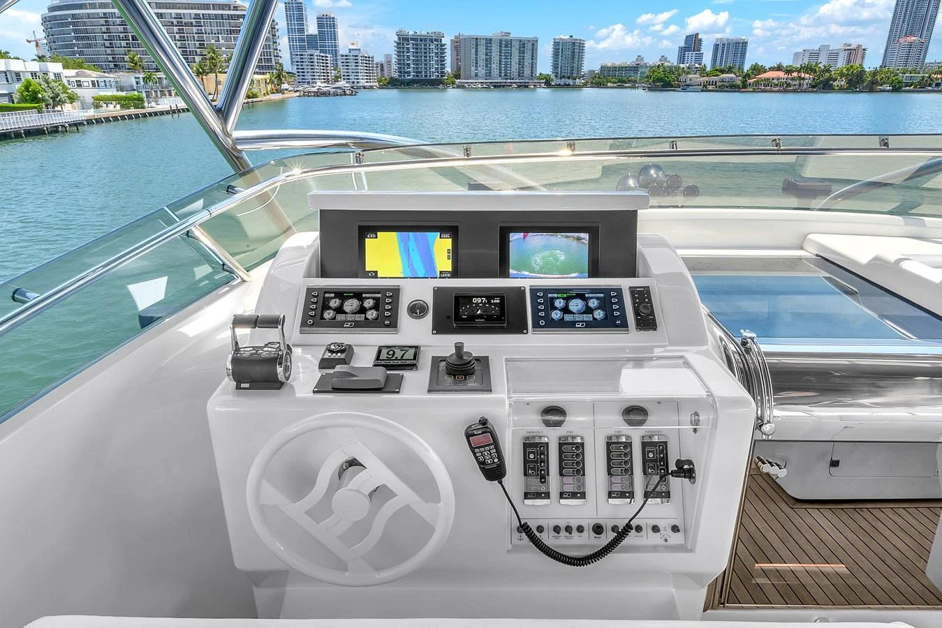The helm station offers a sleek and modern control area with advanced navigation equipment and a stunning view of the water. aboard FERRETTI YACHTS CUSTOM LINE 94 Yacht for Sale