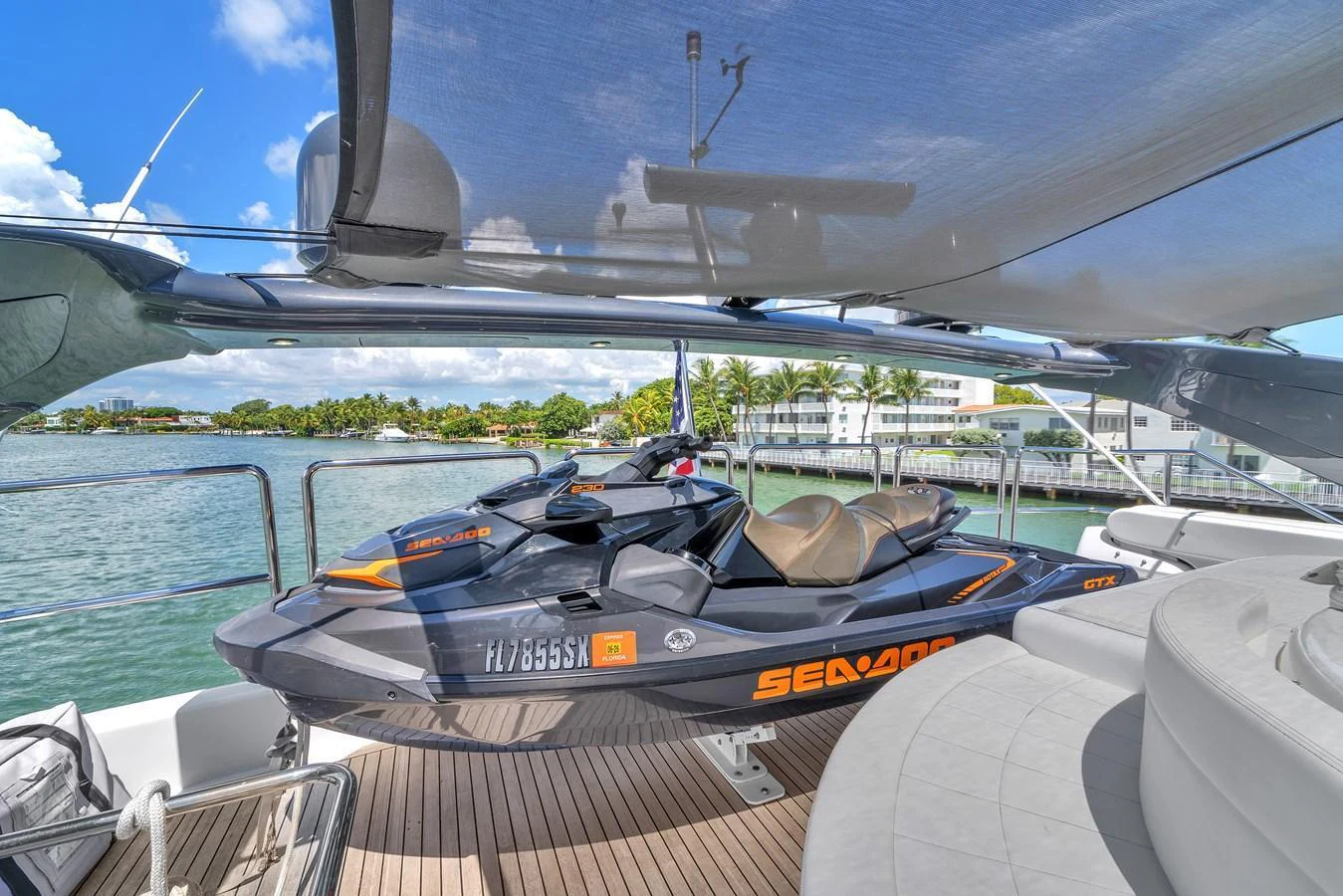 The yacht features a sleek Sea-Doo jet ski on its deck, ready for thrilling water adventures. aboard FERRETTI YACHTS CUSTOM LINE 94 Yacht for Sale