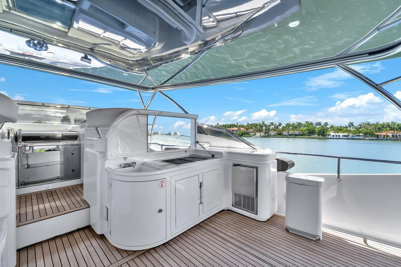 The flybridge offers a spacious and well-equipped area for relaxation and entertainment with stunning views. aboard FERRETTI YACHTS CUSTOM LINE 94 Yacht for Sale