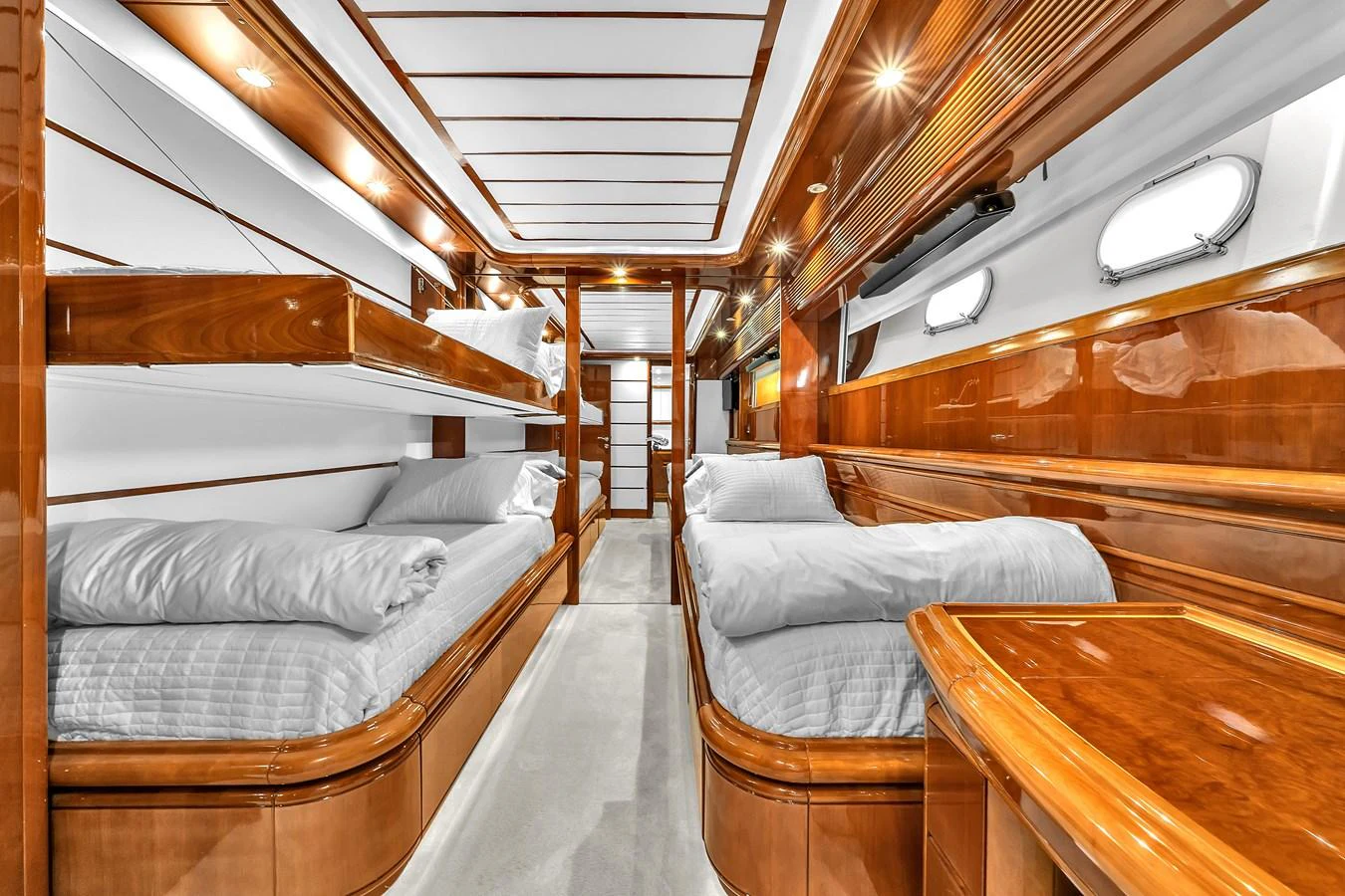 The guest cabin features elegant wood finishes and comfortable twin bunk beds. aboard FERRETTI YACHTS CUSTOM LINE 94 Yacht for Sale