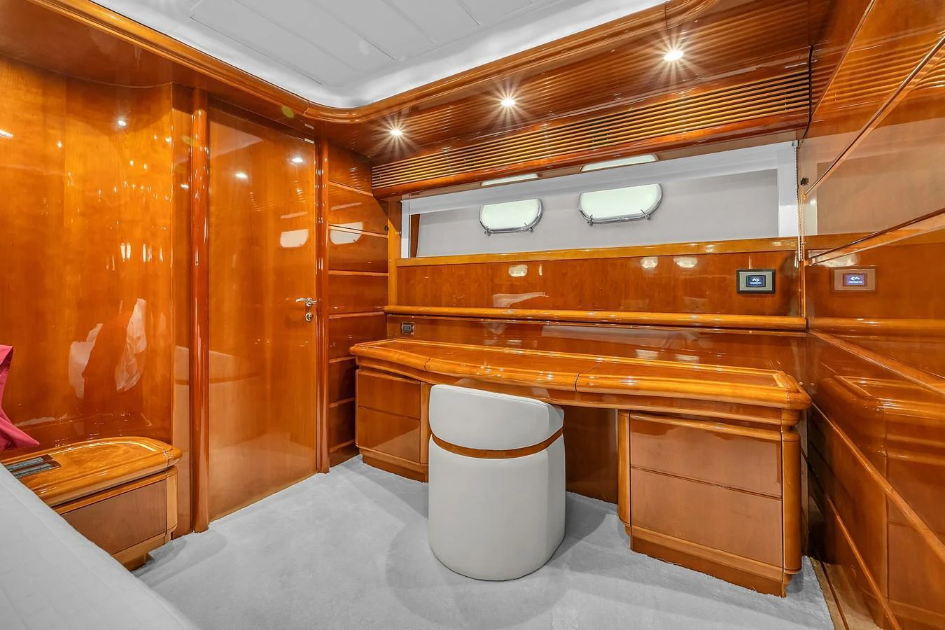 The stateroom features luxurious wood paneling and a sleek, modern design. aboard FERRETTI YACHTS CUSTOM LINE 94 Yacht for Sale