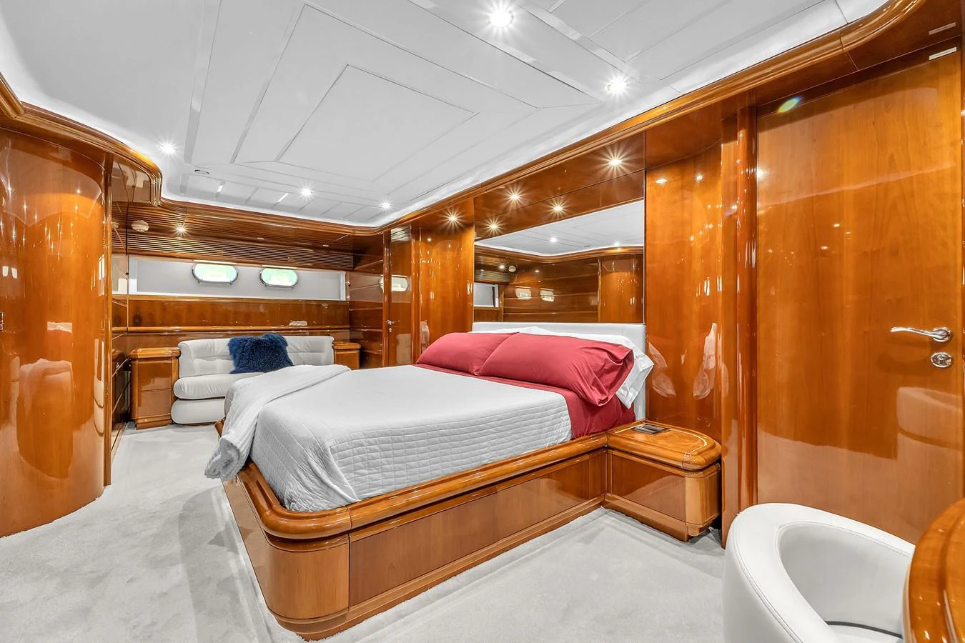 The master stateroom features luxurious wood paneling and a spacious, well-lit layout. aboard FERRETTI YACHTS CUSTOM LINE 94 Yacht for Sale
