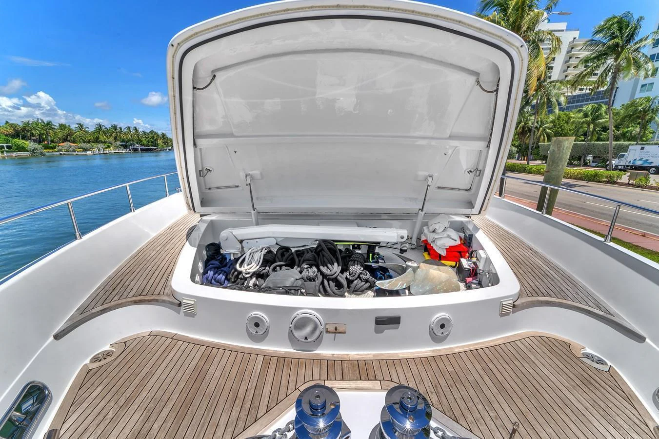 The yacht's storage compartment is open, revealing various equipment and gear neatly organized inside. aboard FERRETTI YACHTS CUSTOM LINE 94 Yacht for Sale