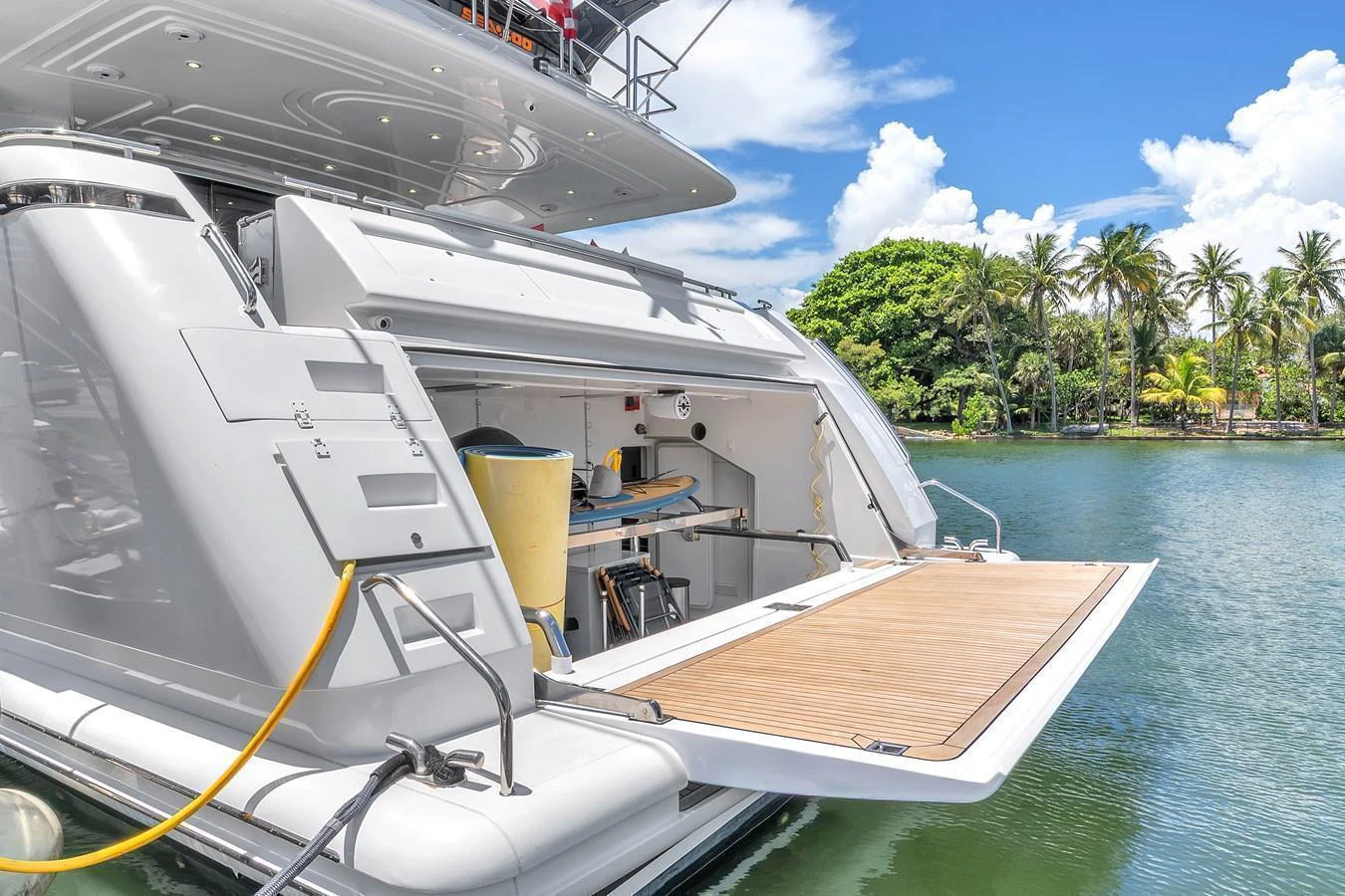 The yacht features a spacious and well-equipped garage area with easy water access. aboard FERRETTI YACHTS CUSTOM LINE 94 Yacht for Sale