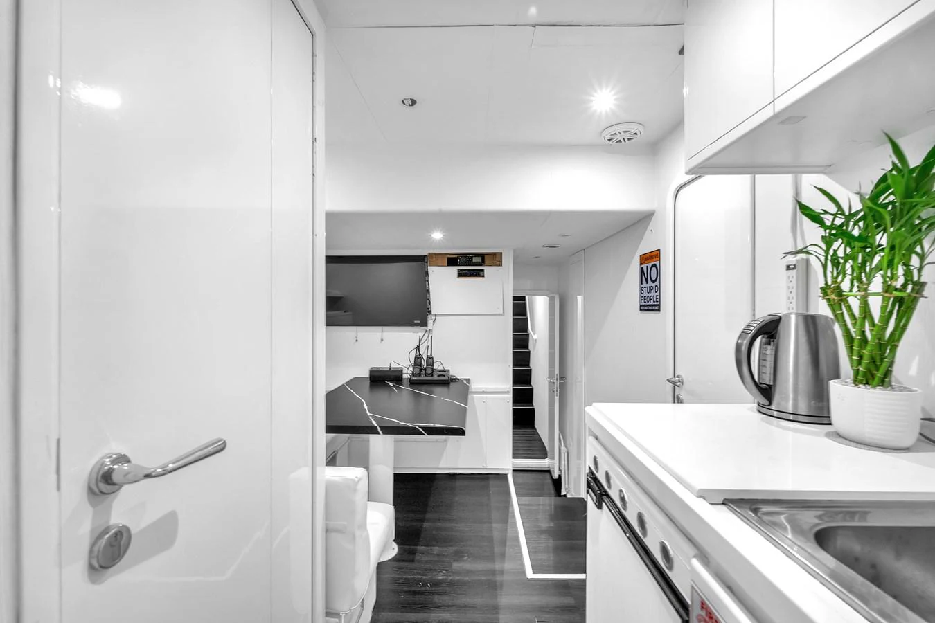 The sleek galley features modern appliances and a minimalist design. aboard FERRETTI YACHTS CUSTOM LINE 94 Yacht for Sale