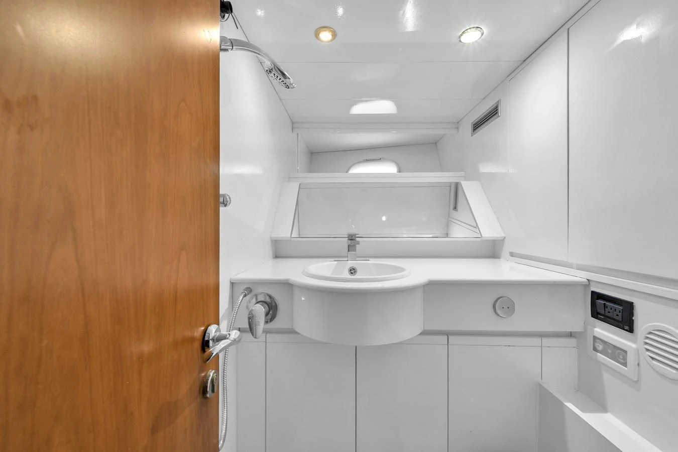 A sleek and modern yacht bathroom with clean lines and ample lighting. aboard FERRETTI YACHTS CUSTOM LINE 94 Yacht for Sale