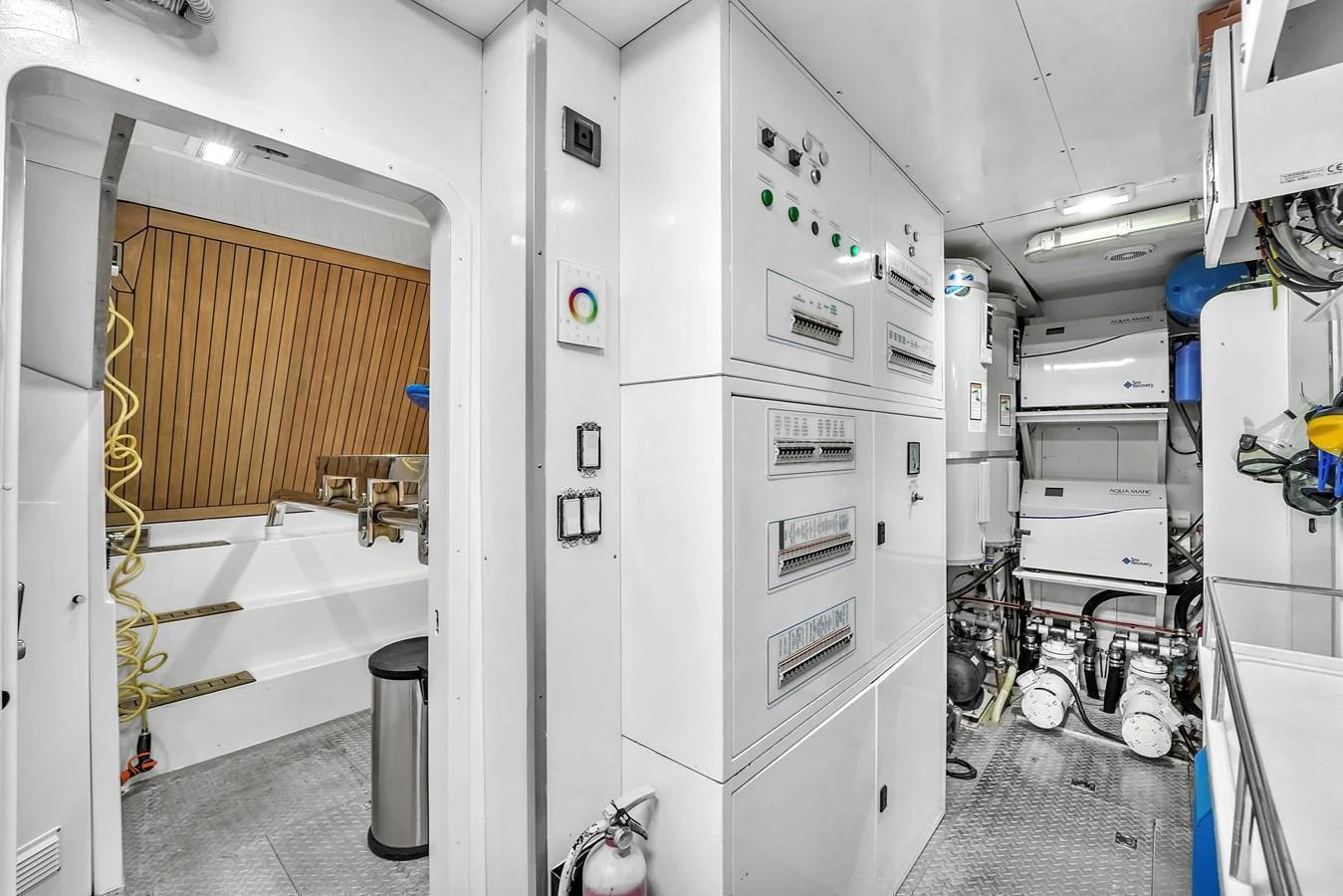 The image showcases the technical and mechanical area of the yacht, featuring control panels and machinery. aboard FERRETTI YACHTS CUSTOM LINE 94 Yacht for Sale