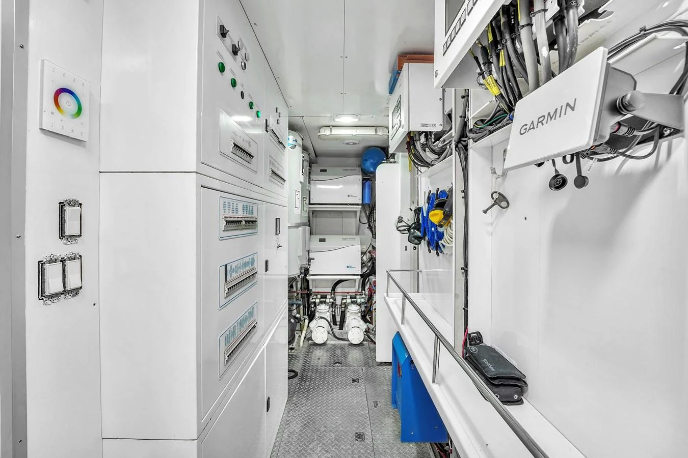 The engine room is equipped with advanced control panels and essential machinery for optimal yacht performance. aboard FERRETTI YACHTS CUSTOM LINE 94 Yacht for Sale