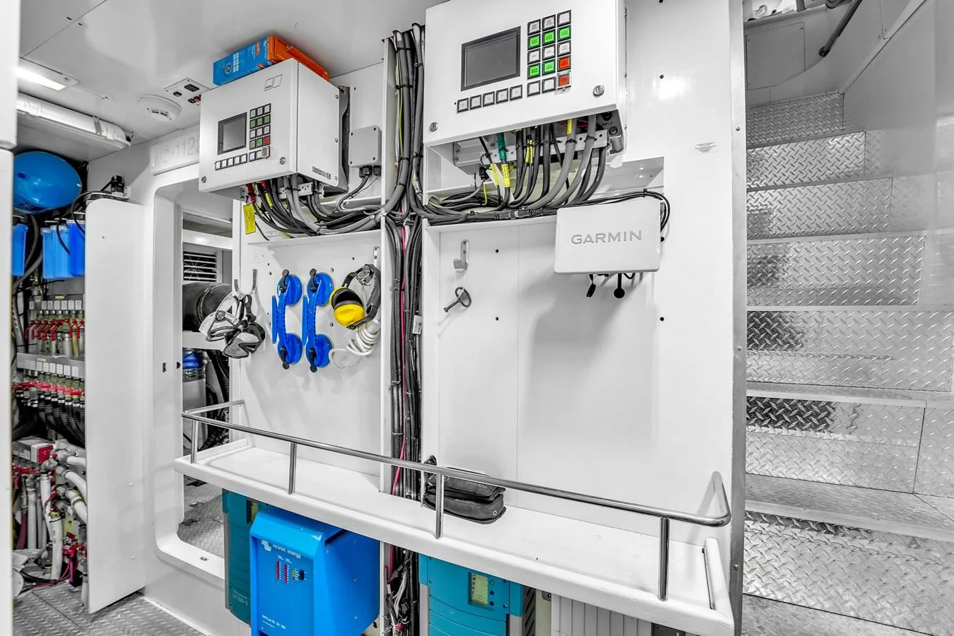 The yacht's engine room showcases advanced control panels and well-organized equipment. aboard FERRETTI YACHTS CUSTOM LINE 94 Yacht for Sale