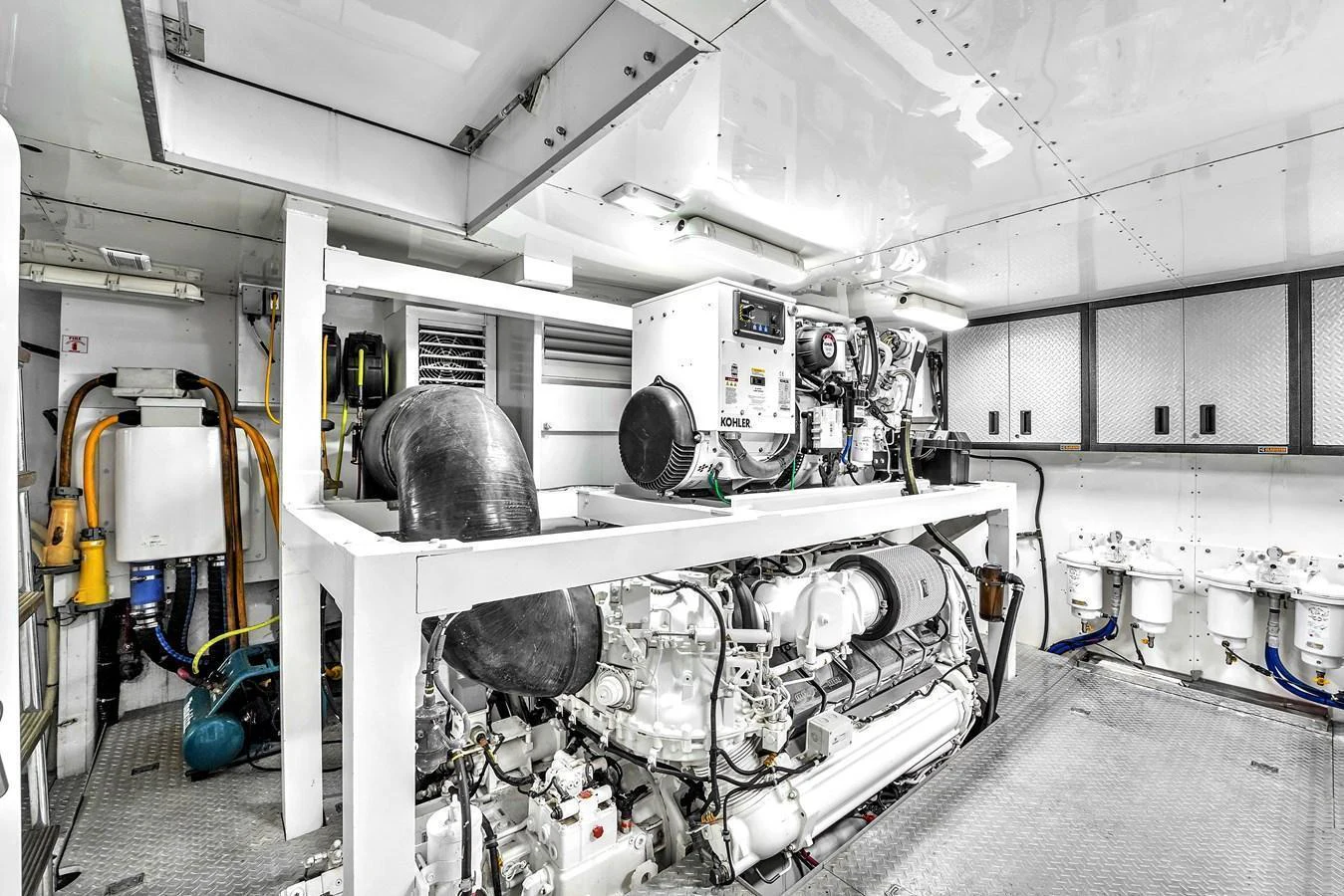 The engine room is equipped with advanced machinery and systems, showcasing a clean and well-maintained space. aboard FERRETTI YACHTS CUSTOM LINE 94 Yacht for Sale