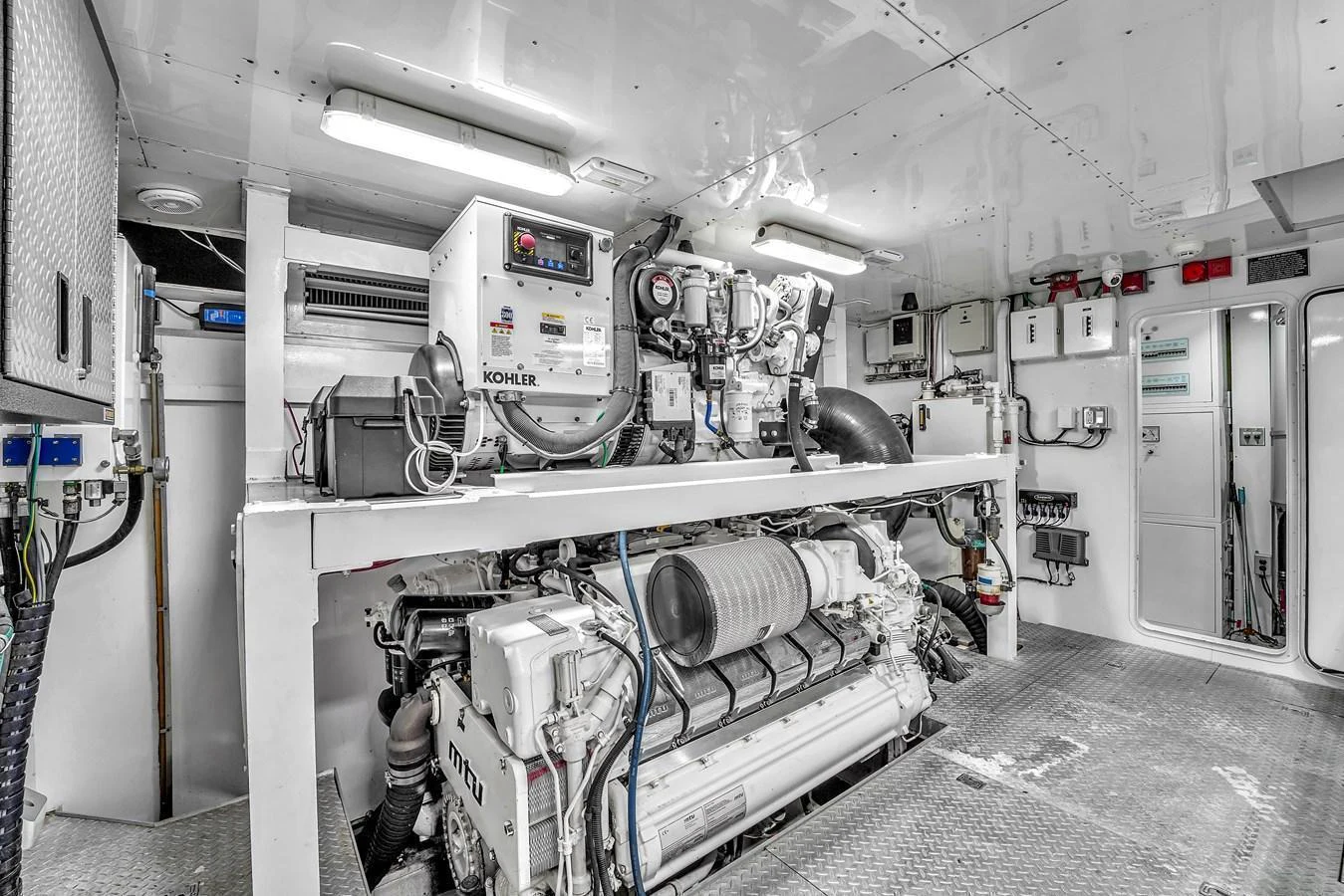 The image showcases the yacht's well-maintained engine room with advanced machinery. aboard FERRETTI YACHTS CUSTOM LINE 94 Yacht for Sale