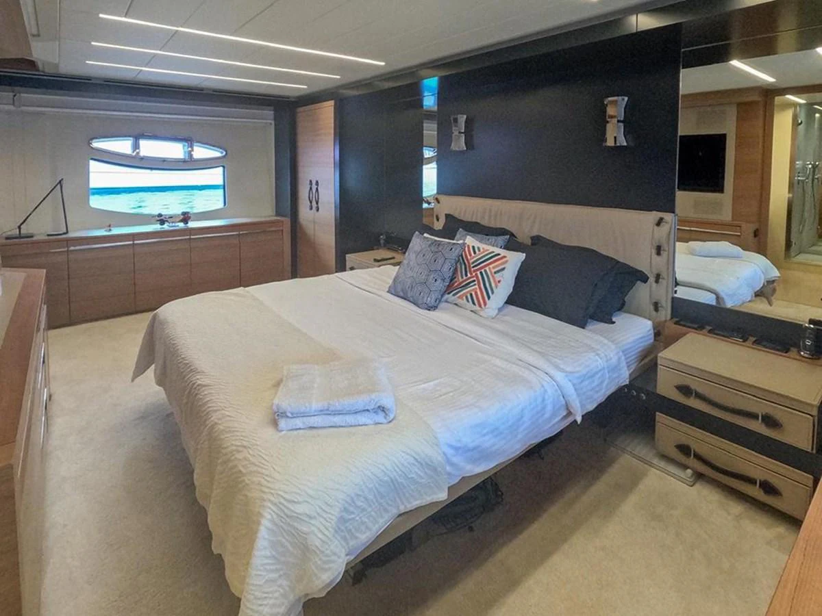 The master stateroom offers a spacious and luxurious sleeping area with modern decor and ample natural light. aboard HONEY BADGER Yacht for Sale