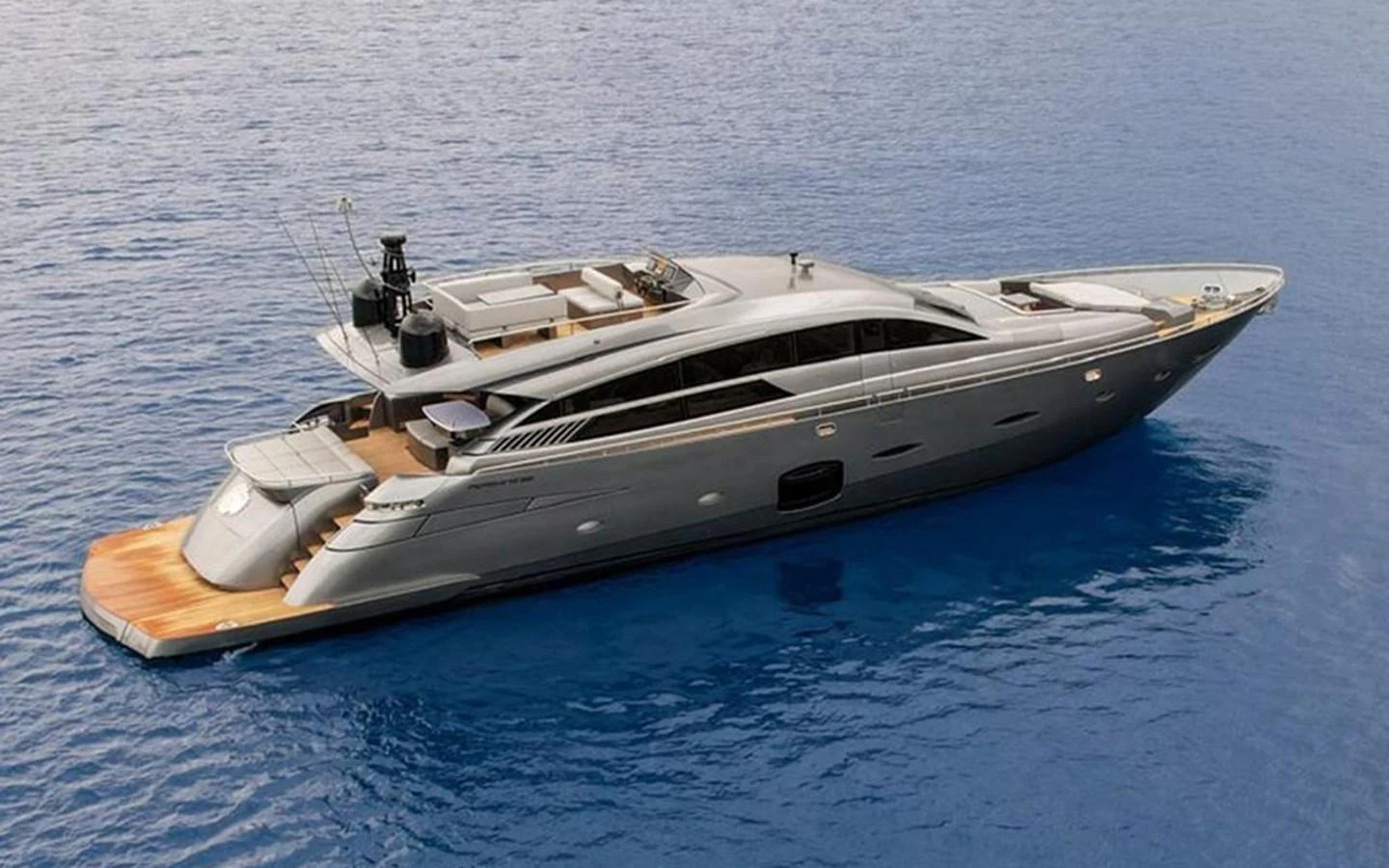 A sleek and modern yacht glides gracefully on calm blue waters. aboard HONEY BADGER Yacht for Sale