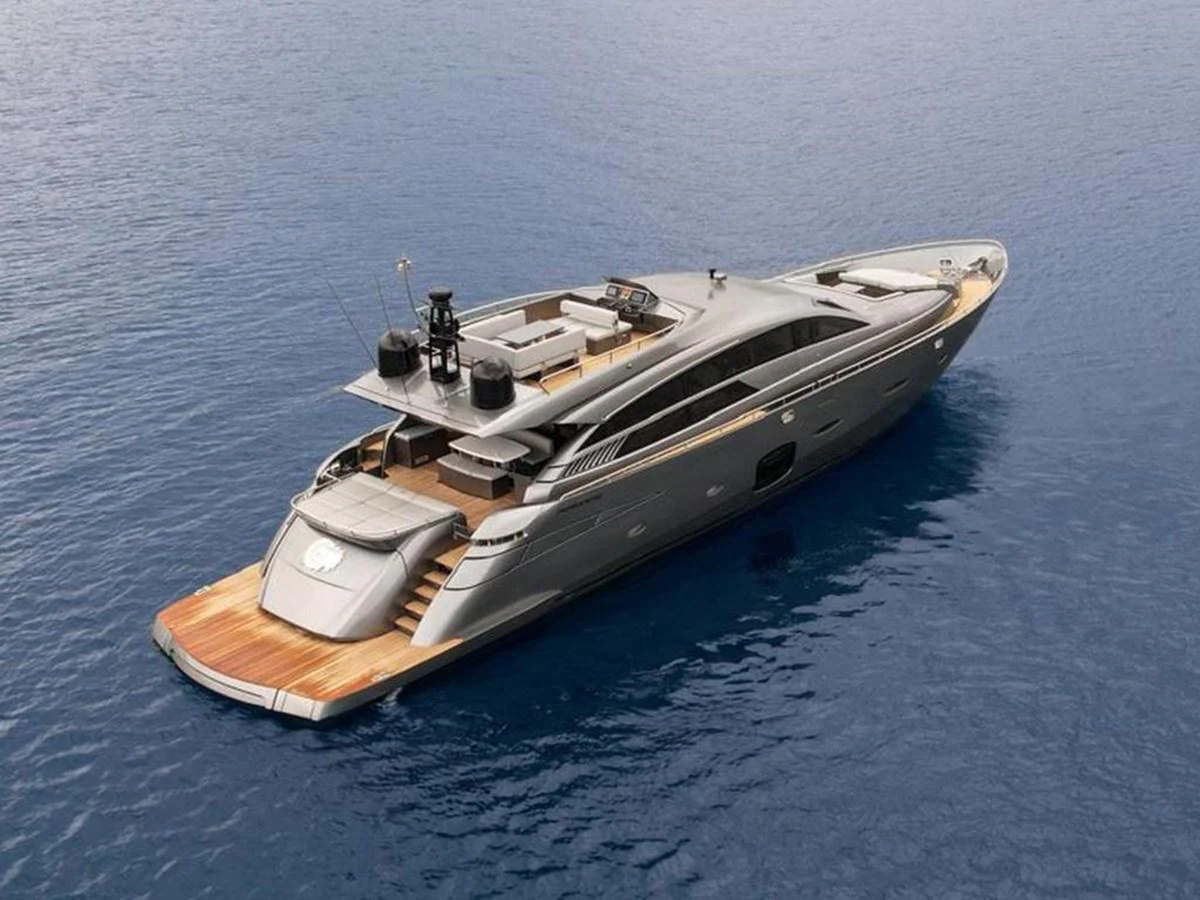 A sleek and modern yacht glides gracefully on the water, showcasing its elegant design and spacious deck areas. aboard HONEY BADGER Yacht for Sale