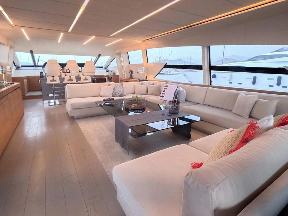 The spacious salon features luxurious seating and panoramic windows for a comfortable and scenic experience. aboard HONEY BADGER Yacht for Sale