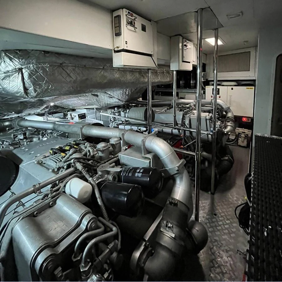 The image showcases the yacht's well-maintained engine room with advanced machinery and equipment. aboard HONEY BADGER Yacht for Sale