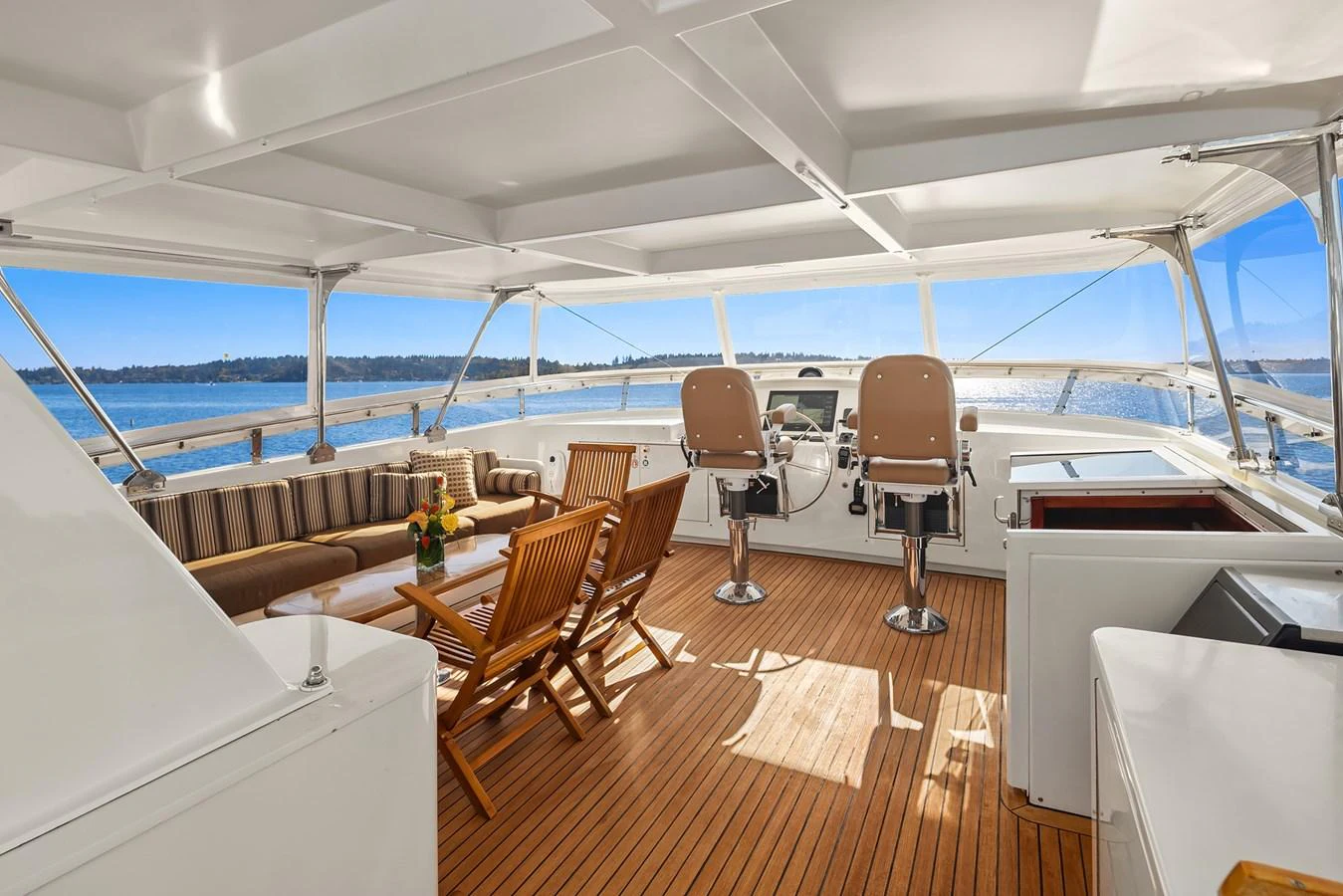 The flybridge offers a spacious and inviting area with comfortable seating and panoramic views. aboard MI AMERE Yacht for Sale