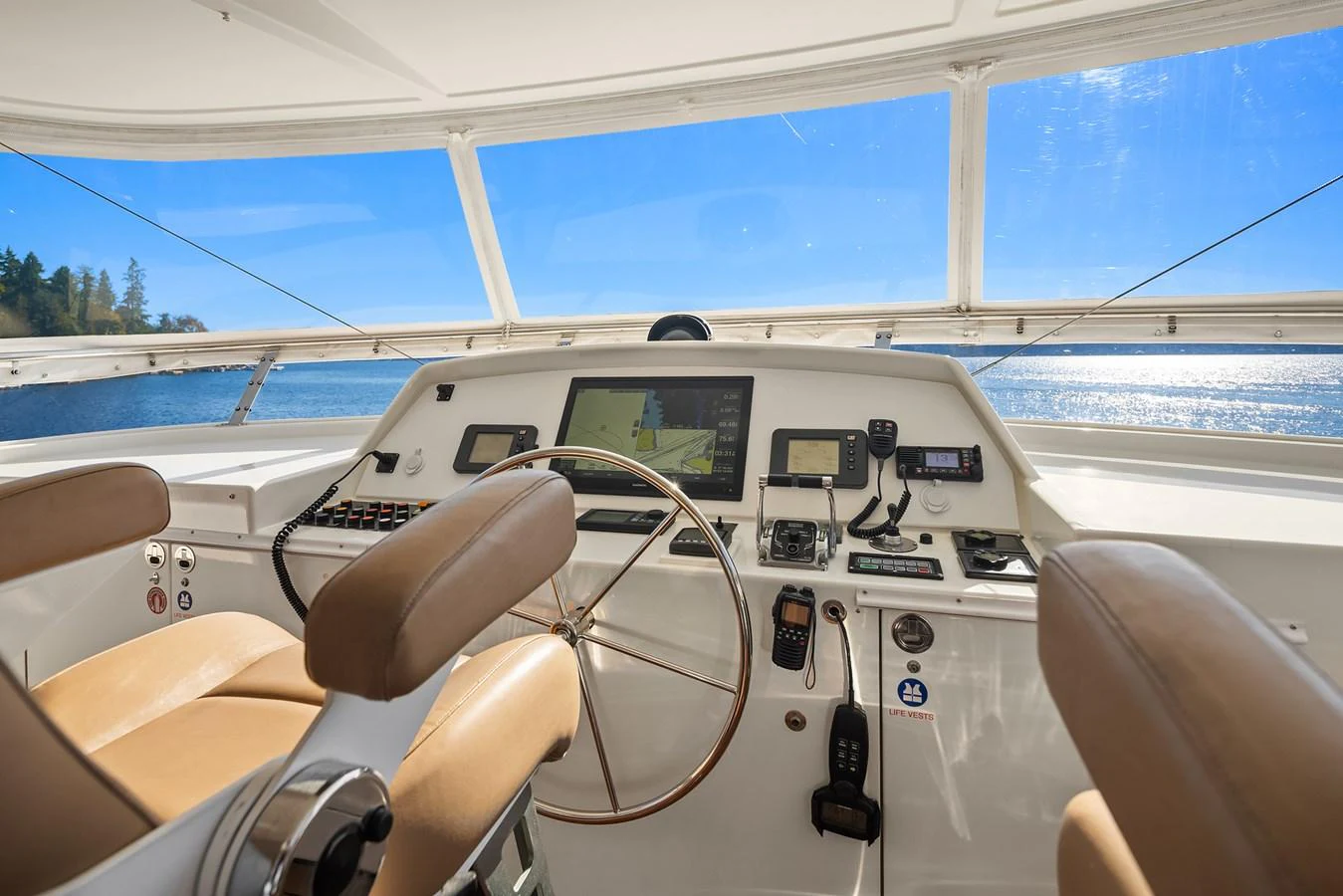 The helm station offers a commanding view with state-of-the-art navigation equipment and luxurious seating. aboard MI AMERE Yacht for Sale
