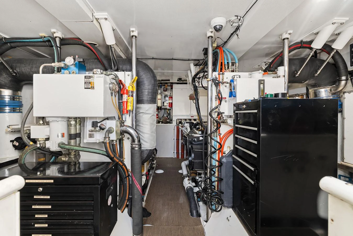 The image showcases the well-organized engine room with various mechanical components and tools. aboard MI AMERE Yacht for Sale