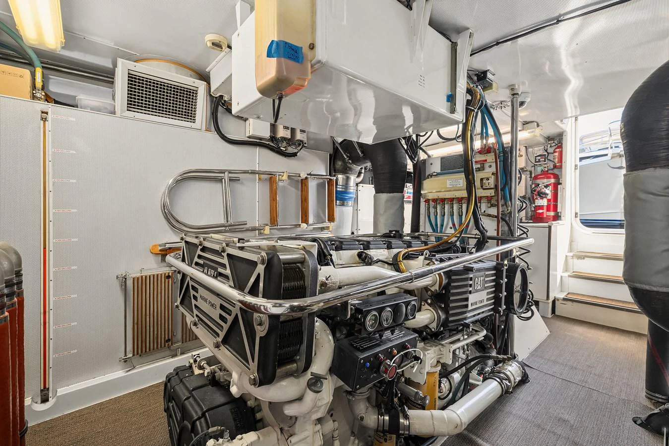 The image showcases the well-maintained engine room of the yacht, highlighting its mechanical components and systems. aboard MI AMERE Yacht for Sale