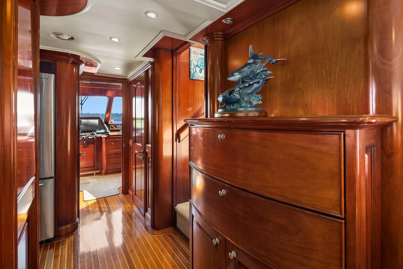 A luxurious hallway with rich wood paneling and elegant decor. aboard MI AMERE Yacht for Sale