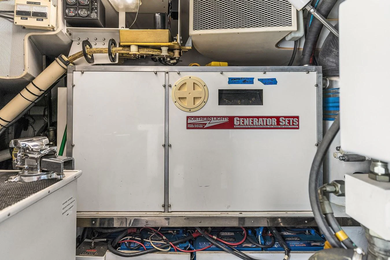 The image showcases the generator set within the yacht's engine room, highlighting its technical components. aboard MI AMERE Yacht for Sale