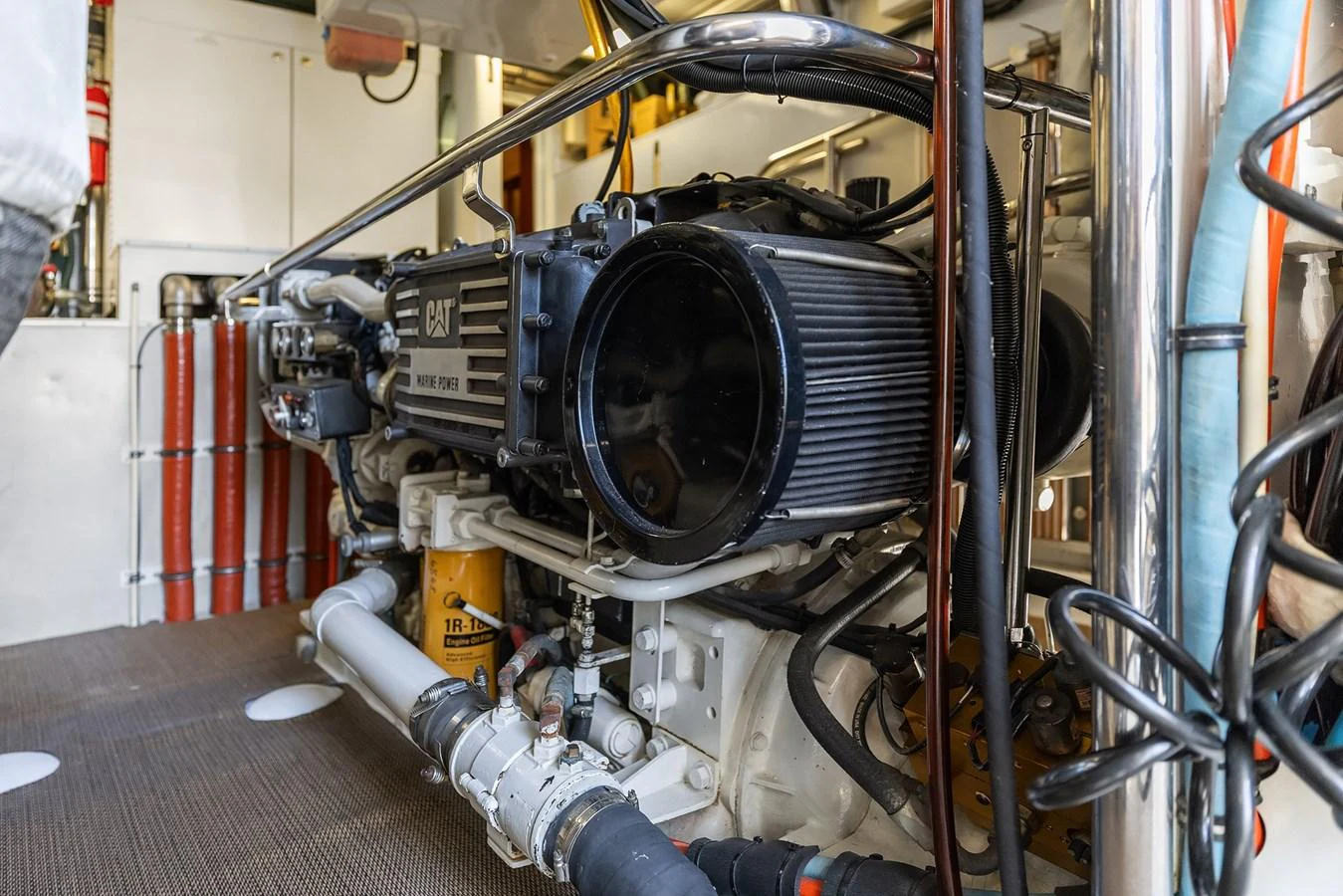 The image showcases the well-maintained engine room of the yacht, featuring a powerful CAT marine engine. aboard MI AMERE Yacht for Sale