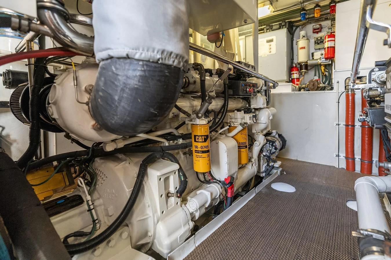 The image showcases the well-maintained engine room of the yacht, highlighting its powerful machinery. aboard MI AMERE Yacht for Sale