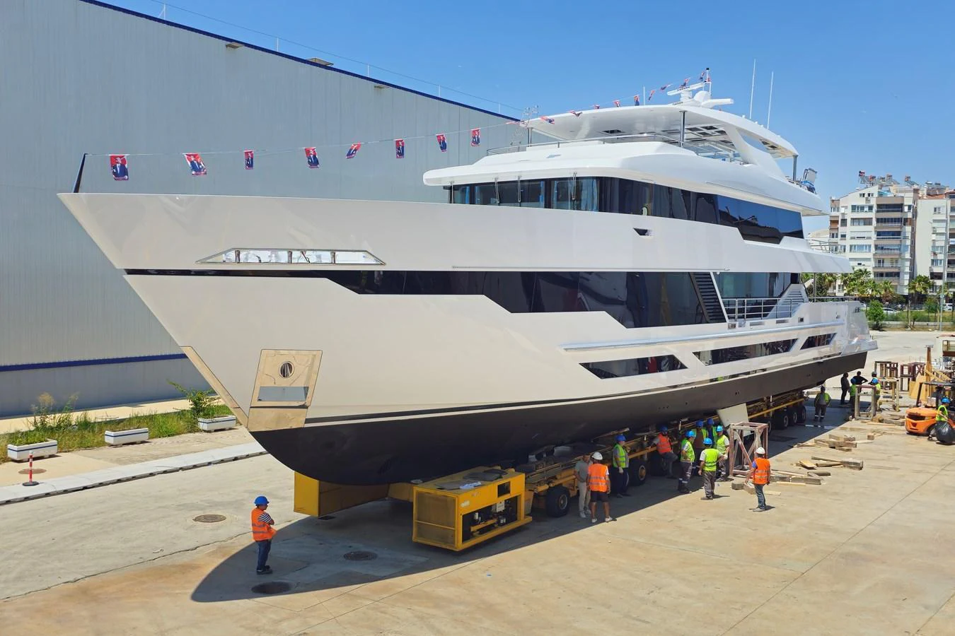 A sleek and modern yacht is being prepared for launch at the shipyard. aboard E SERIES 125 HARGRAVE SUPERYACHTS Yacht for Sale